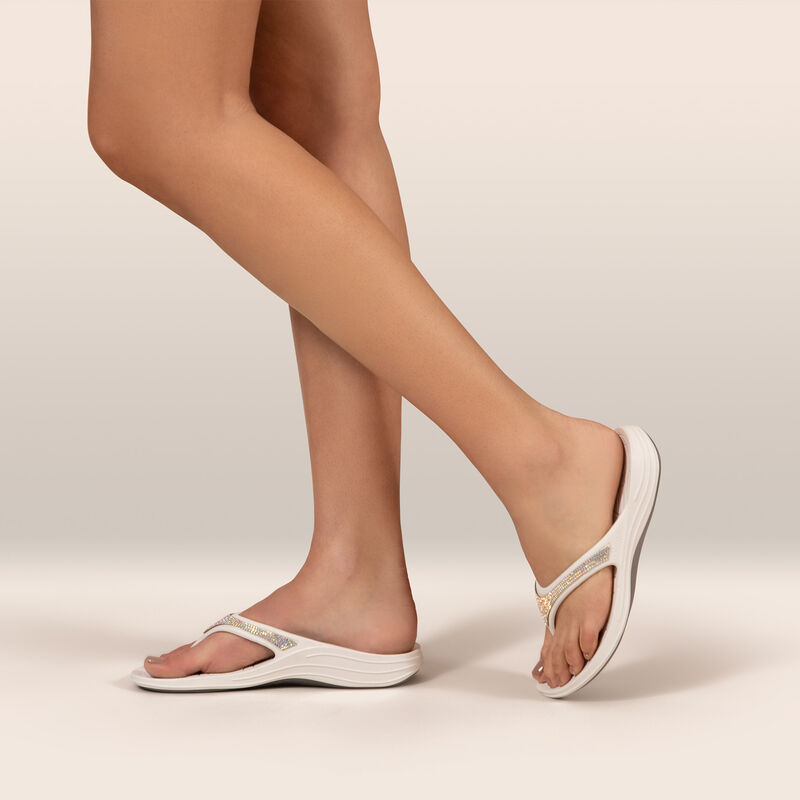 white sparkle orthotic flip flops on feet